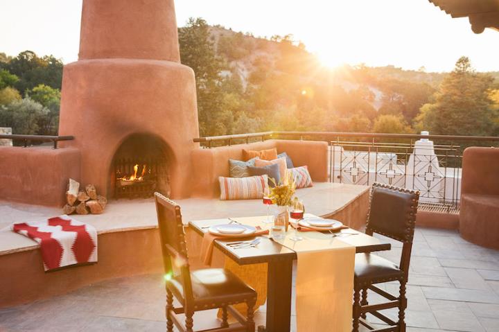 Dinner for two on a terrace with an earthenware open fire